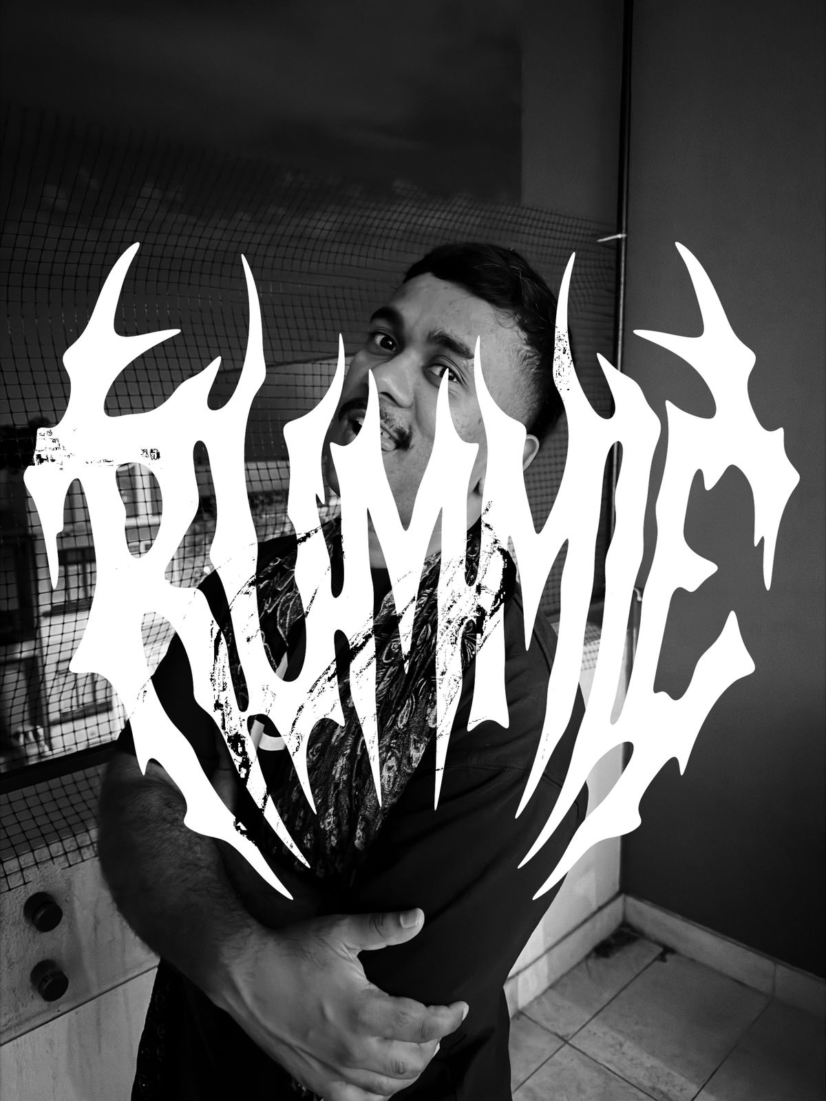 Black and white press shot of Rummie with the Rummie logo